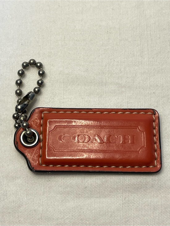 Coach Handbags - Coach Leather Hang Tag in Burnt Orange with Silver Ball Chain